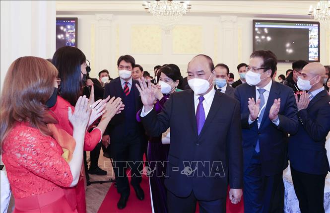 Chủ tịch nước Nguyễn Xuân Phúc gặp gỡ đại diện cộng đồng Việt Nam tại Liên bang Nga. Ảnh: Thống Nhất/TTXVN